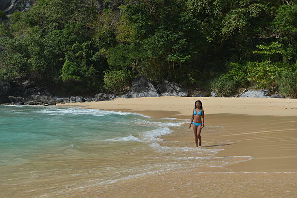 Fashion shot of a Philippina on the Exotic beach Fashion shot of a Philippina on the Exotic beach near El Nido City, Palawan Island summer fashion philippines palawan stock pictures, royalty-free photos & images
