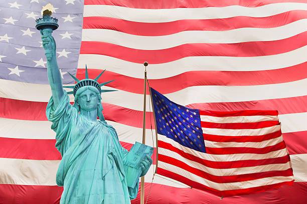 istock Statue of Liberty and Two American flag 477832019