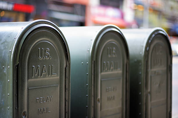 屋外 mailboxes - postal worker delivering mail post office ストックフォトと画像