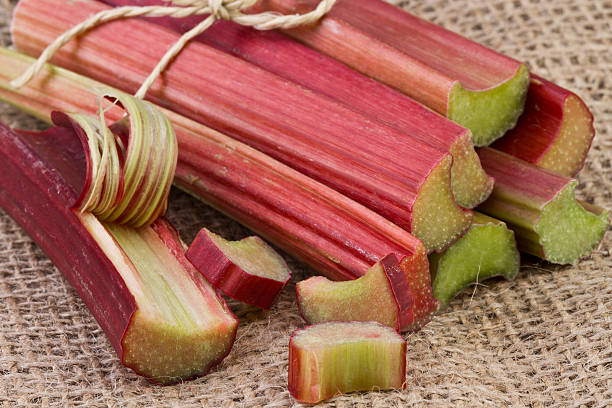istock Bundle of Rhubarb Stalks on jute background 477834762