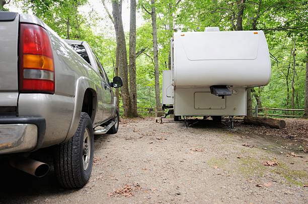istock Fifth wheel travel trailer in campground 477836183