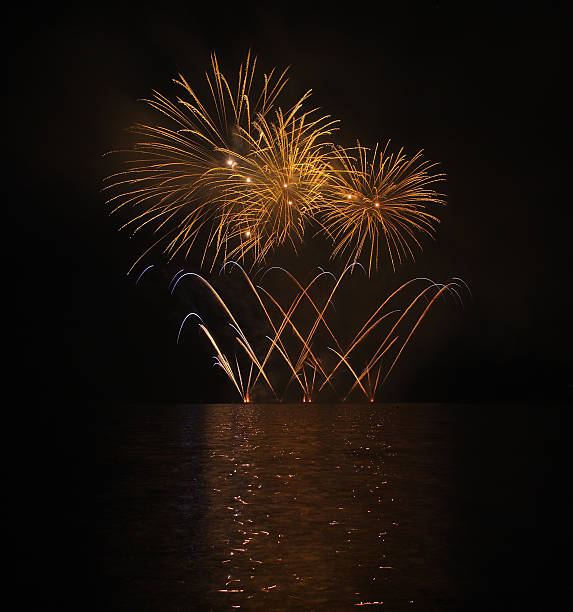 istock Colorful fireworks with reflection on lake. 477836560