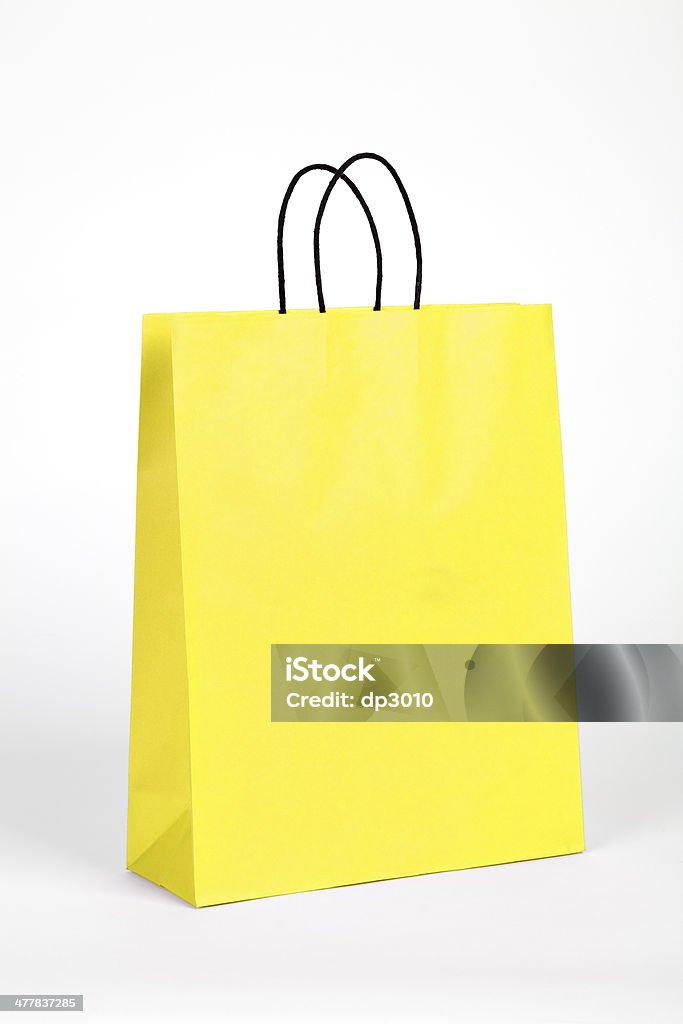 黄色のショッピングバッグ。 - カットアウトのロイヤリティフリーストックフォト
