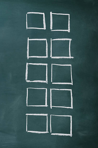 Row of blank check boxes on blackboard with copy space