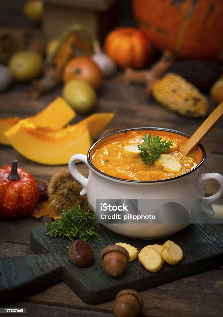 Pumpkin soup Hot pumpkin soup on the rustic wooden table Appetizer Stock Photo