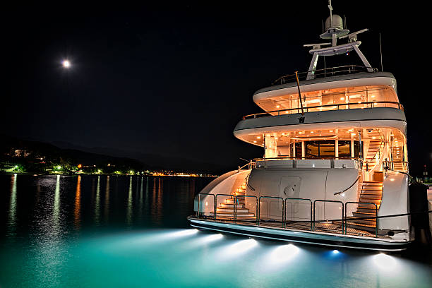Yacht in marina Luxury yacht in marina at night. yacht stock pictures, royalty-free photos & images