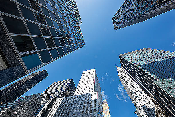 Business Towers Business towers in New York City image created 21st century blue architecture wide angle lens stock pictures, royalty-free photos & images