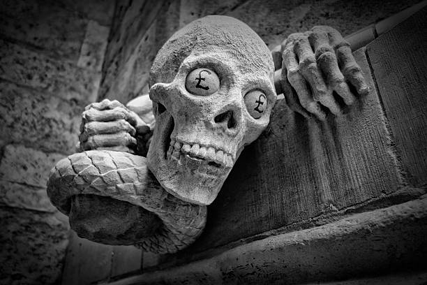 Lincoln Cathedral architectural detail - skull and serpent carved in stone.