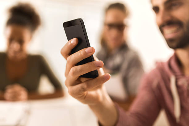 istock Close up of a man using mobile phone. 477841242