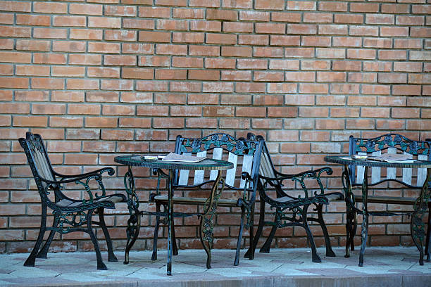 istock Beaten metal cafe tables and chairs 477842378