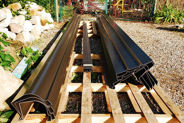 House Guttering on Pallet New house guttering on a pallet waiting to be installed on a house. zinced steel stock pictures, royalty-free photos & images