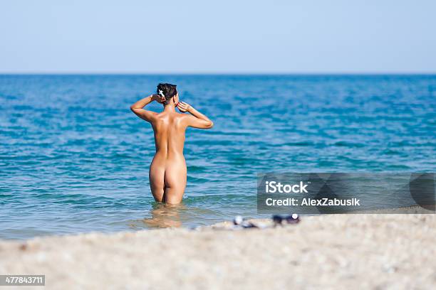 Girl At The Sea Stock Photo - Download Image Now - Naked, Nudist, Beach