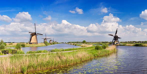 Traditional Dutch windmills on a bright and sunny day at the Kinderdijk in The Netherlands.