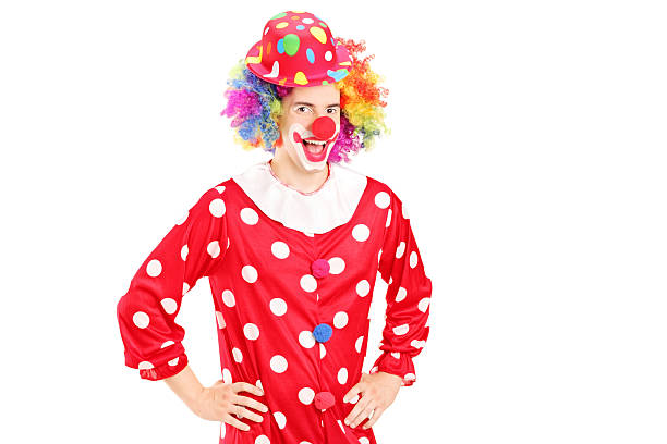 istock Smiling happy clown in red costume posing 477844173