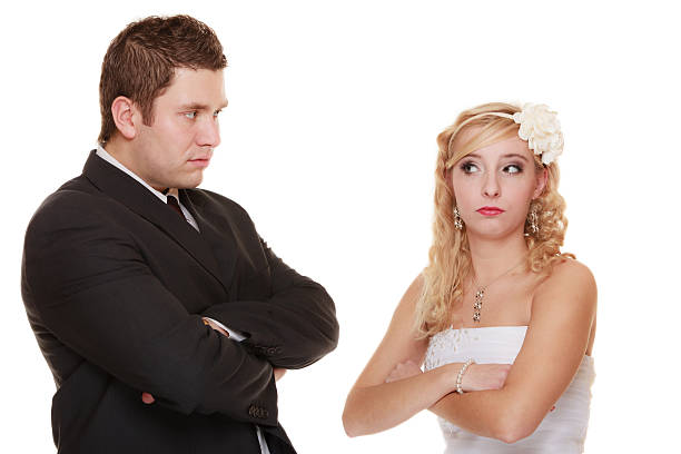 istock bride and groom looking at each other offended 477845108
