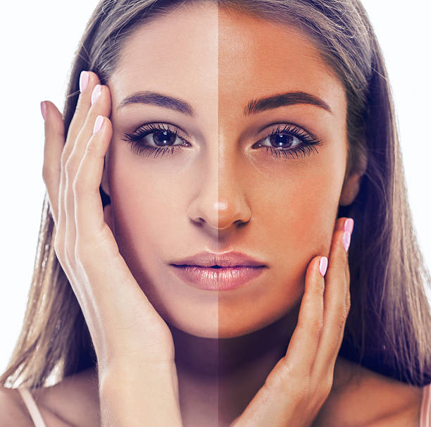 istock woman tan half face beautiful portrait studio 477845178