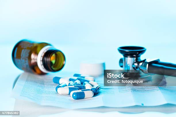 Tablets And Stethoscope On Package Leaflet Stock Photo - Download Image Now - 2015, Abuse, Bottle