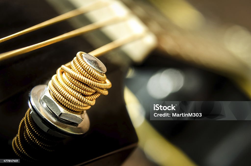 Close up detail of guitar string Close up detail of guitar string and blurred background Abstract Stock Photo