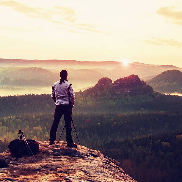 istock Professional in white jacket  takes photos with camera on tripod 477847706