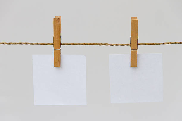 istock post it reminders and clothespins attached to a rope 477847940