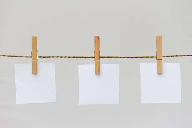 istock post it reminders and clothespins attached to a rope 477847946