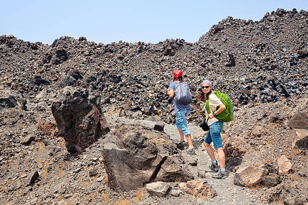 istock Tow female hiker on walk in volcano crater. 477848405