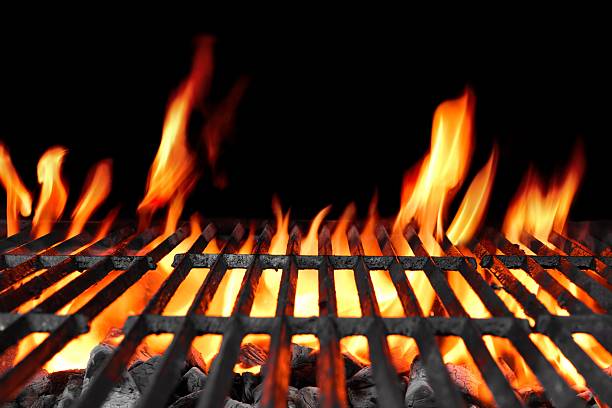 Empty Hot Flaming Charcoal Barbecue Grill Empty Hot Charcoal Barbecue Grill With Bright Flame On The Black Background metal grate stock pictures, royalty-free photos & images