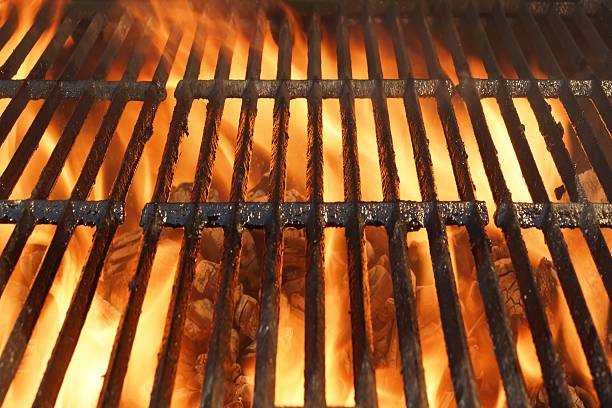 istock Flaming BBQ Charcoal Grill Background 477848602