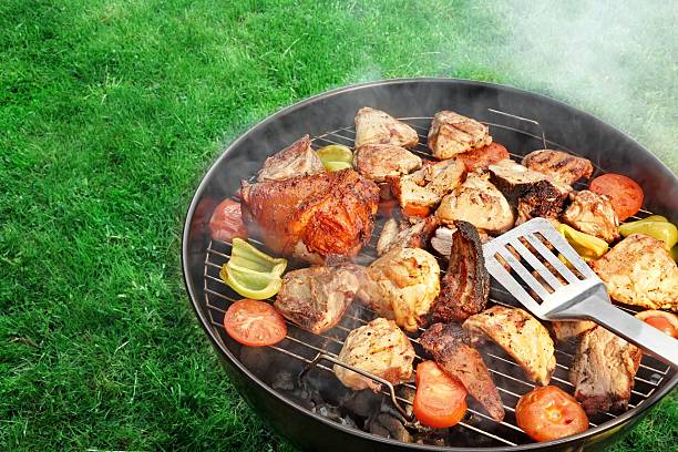 istock BBQ Assorted Meat And Vegetables On The Hot Flaming Grill 477850318
