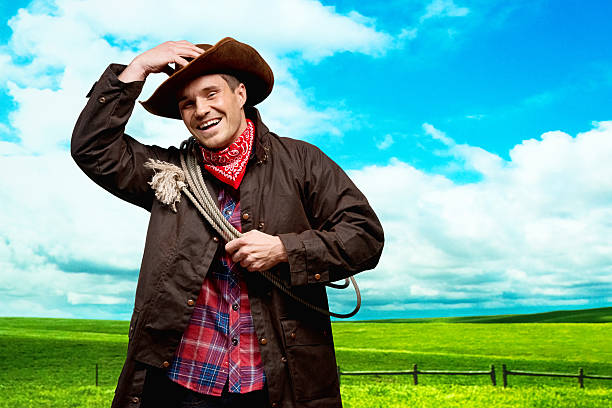 istock Happy cowboy standing in outdoors 477851175