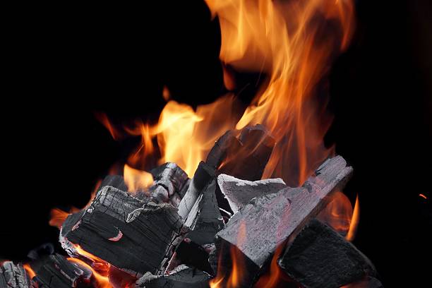 istock Burning Firewood And Glowing Coals Close-up Background 477851434