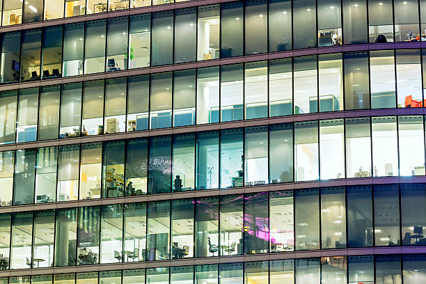 istock Illuminated office buildings in London 477851511