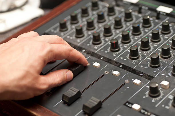 mixing desk with hand human hands handling with mixing desk regler stock pictures, royalty-free photos & images