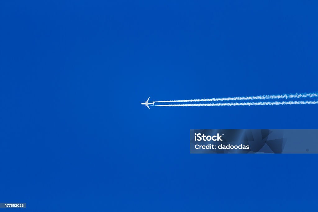 jet airplane on blue sky jet plane in the blue sky, the trace of the Turbines 2015 Stock Photo