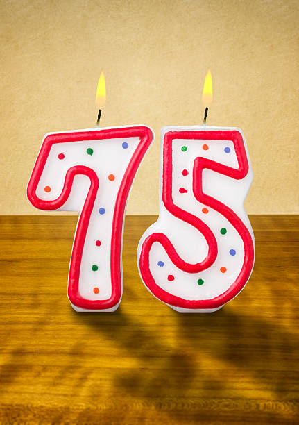 istock Burning birthday candles number 75 477853286