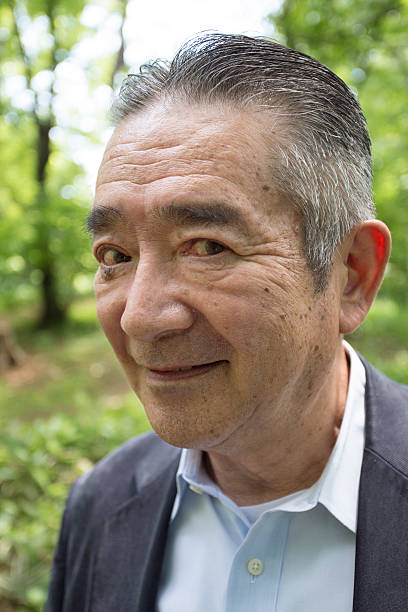 istock Japanese Senior Man with Mischievous Face 477855624