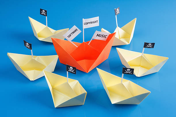 istock Ship and several pirate boats 477855670