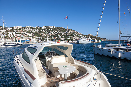 Luxury yachts and motorboats in the marina of Roses, Catalonia, Spain