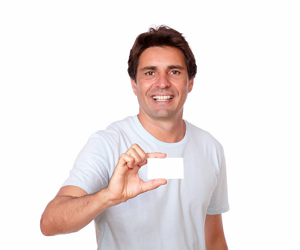 istock Handsome man holding a blank business card 477856979