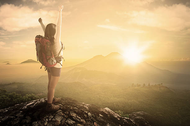 istock Female backpacker enjoying freedom at mountain 477859712