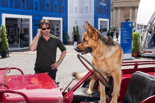 Rome, Italy - May 20, 2011: The actor Ettore Bassi and the dog Rex, stars of the hit television series 