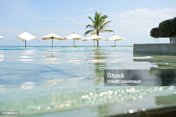 Swimming Pool With Umbrellas Stock Photo - Download Image Now - Beach, Horizontal, Infinity Pool