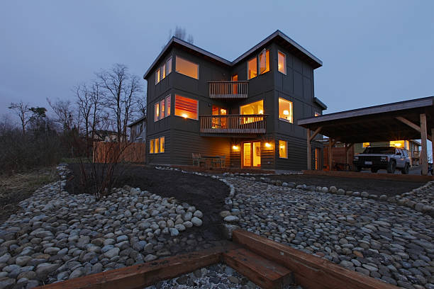 istock Large modern house in the evening with all lights on 477861209