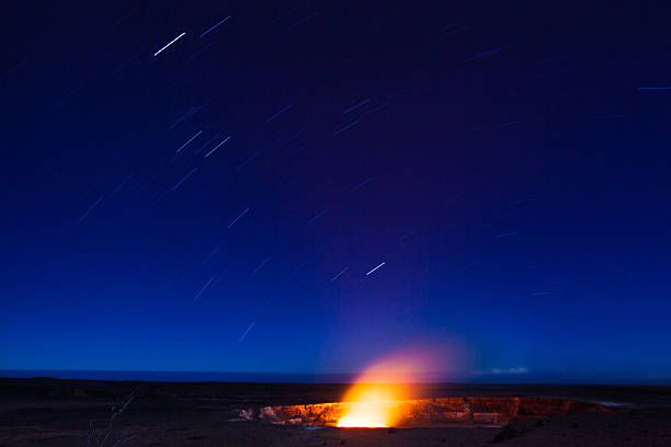 eruption at night - pelé stok fotoğraflar ve resimler