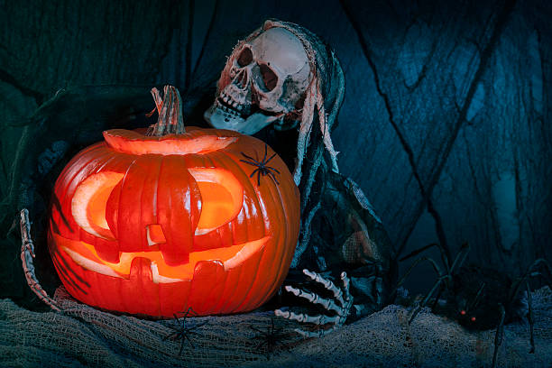 istock Skull monster and halloween pumpkin 477864147