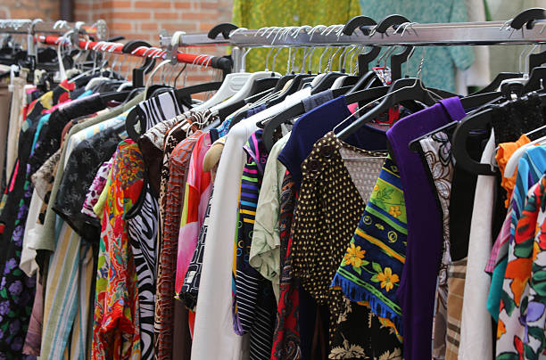 istock vintage clothes hanging at flea market 477866714