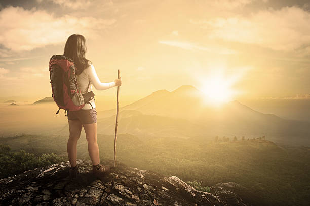 istock Hiker at mountain peak looking the valley view 477867490
