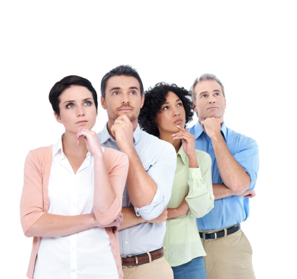 A group of four multi-ethnic people looking up pensively