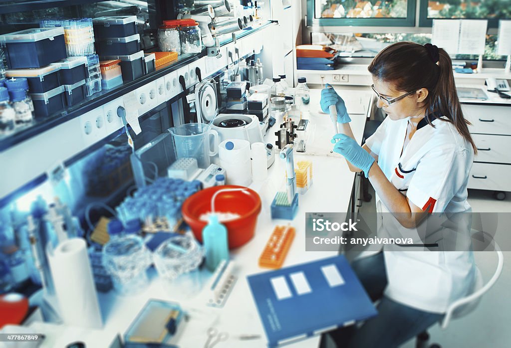 Scientist works in the lab Young scientist works in modern biological lab Laboratory Stock Photo