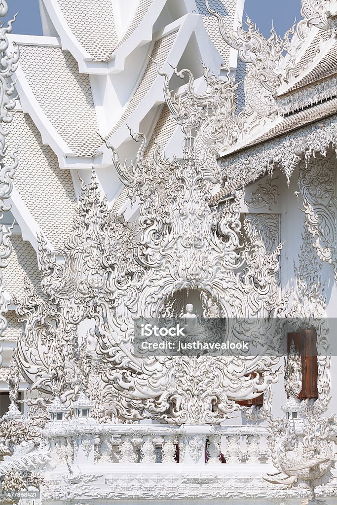 Detail of Wat Rong Kuhn Detail of Wat Rong Kuhn, designed by Chalermchai Kositpipa as contemporary temple in unconventional style. So called white temple of Thailand in Chiang Rai. Architecture Stock Photo